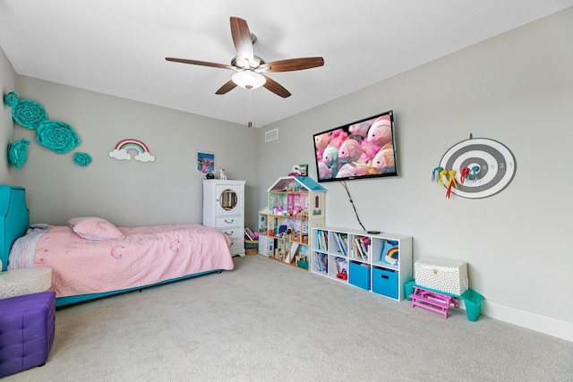 carpeted bedroom featuring a ceiling fan, visible vents, and baseboards