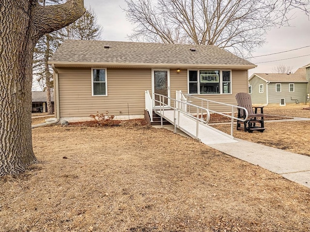 view of front of home with a shingled roof