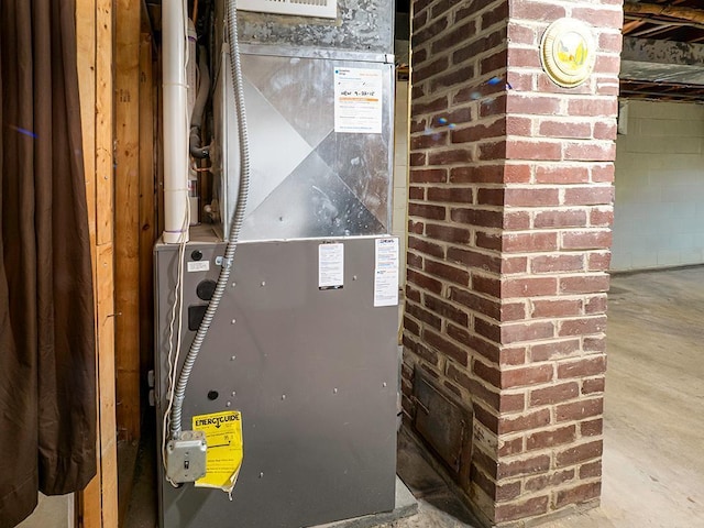 utility room with heating unit