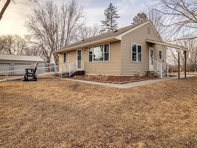 ranch-style house featuring an outbuilding