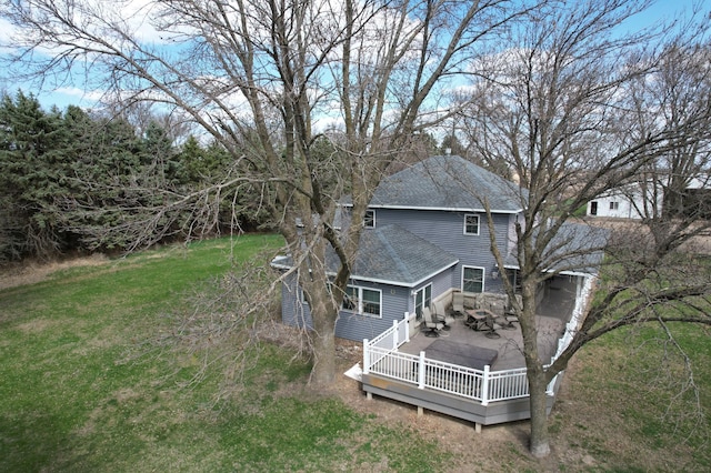 1344 385th Ave, Ten Mile Lake Twp, MN 56218 - back of property featuring roof with shingles, a wooden deck, and a lawn