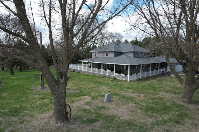 1344 385th Ave, Ten Mile Lake Twp, MN 56218 - rear view of house featuring a shingled roof and a lawn