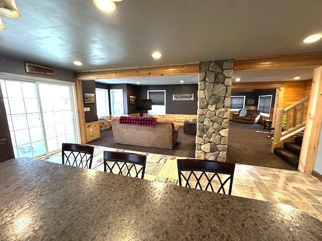 1344 385th Ave, Ten Mile Lake Twp, MN 56218 - dining space with decorative columns, stairs, and recessed lighting