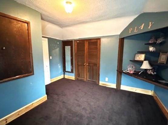 1344 385th Ave, Ten Mile Lake Twp, MN 56218 - unfurnished bedroom with baseboards, a textured ceiling, and carpet flooring