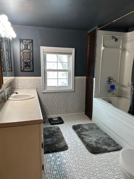 1344 385th Ave, Ten Mile Lake Twp, MN 56218 - full bathroom with tile walls, wainscoting, shower / bathtub combination with curtain, vanity, and tile patterned flooring