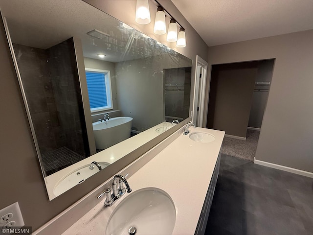 full bathroom featuring a sink and baseboards