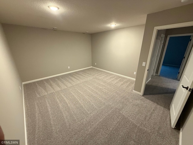 interior space with baseboards and a textured ceiling