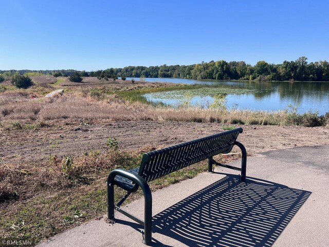 surrounding community with a water view