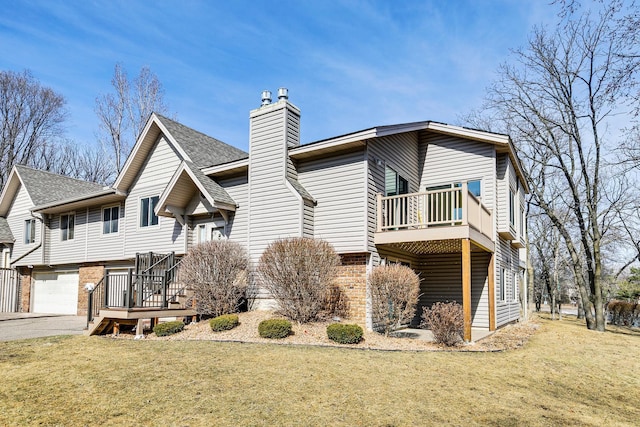 rear view of house with a yard and brick siding