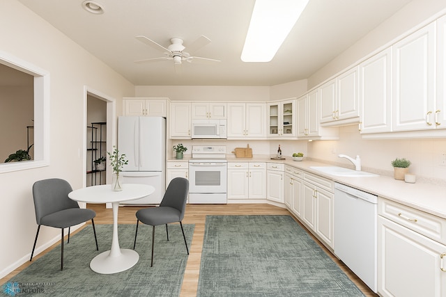 2501 30th Ave S Unit 102, Fargo, ND 58103 - kitchen featuring white appliances, a sink, light wood-style floors, ceiling fan, and white cabinetry