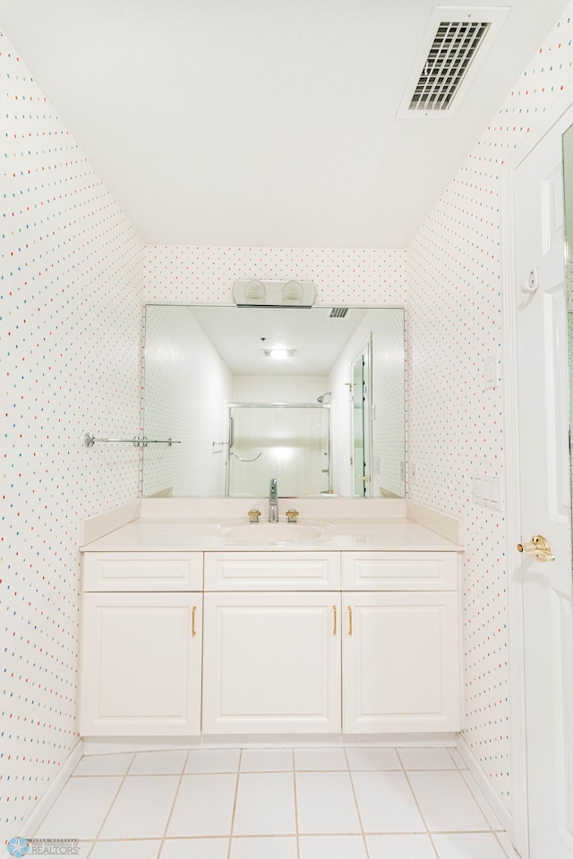 2501 30th Ave S Unit 102, Fargo, ND 58103 - bathroom featuring wallpapered walls, baseboards, vanity, and tile patterned floors