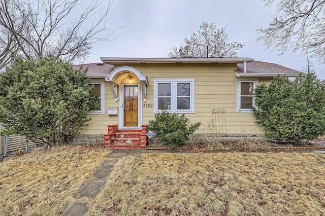 view of front of home with fence