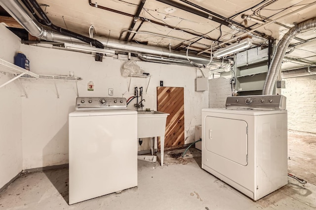 laundry room featuring washer and dryer and laundry area