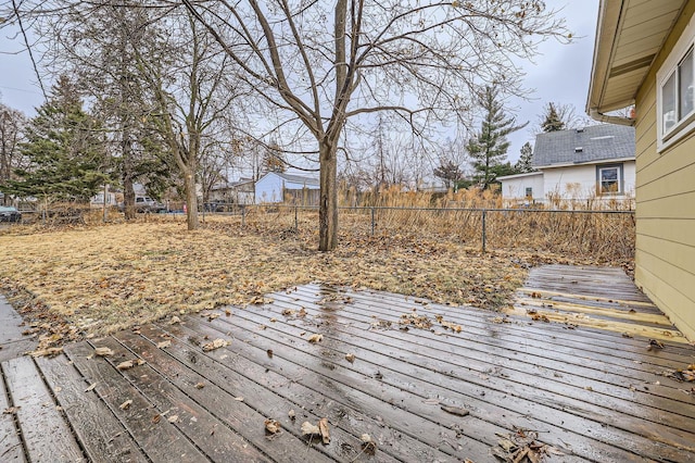 wooden terrace featuring a fenced backyard