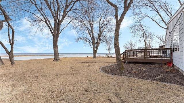 view of yard featuring a deck with water view