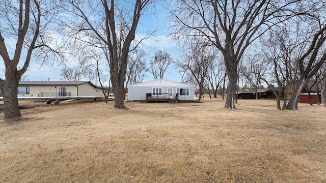 view of yard with a wooden deck