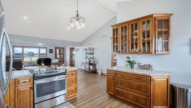 kitchen featuring visible vents, a notable chandelier, stainless steel appliances, light wood-style floors, and vaulted ceiling with beams