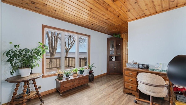 home office featuring light wood-style flooring, wood ceiling, and baseboards