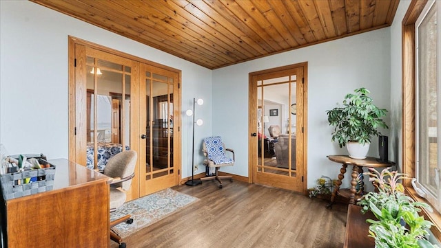 office space featuring french doors, wood ceiling, baseboards, and wood finished floors