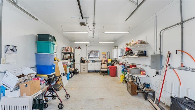 garage featuring electric panel and a garage door opener