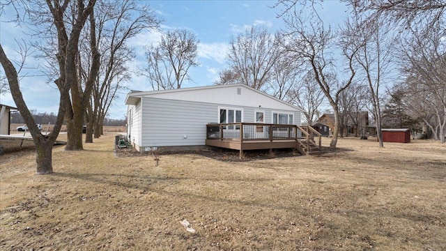 back of house featuring a deck