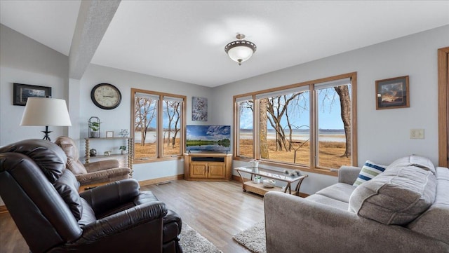 living room featuring light wood-style flooring and baseboards
