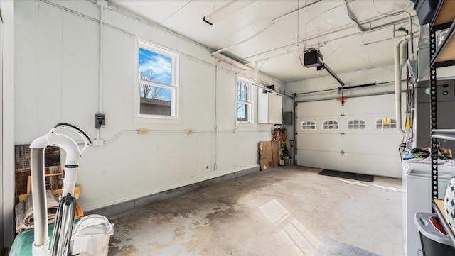 garage with washer / clothes dryer and a garage door opener