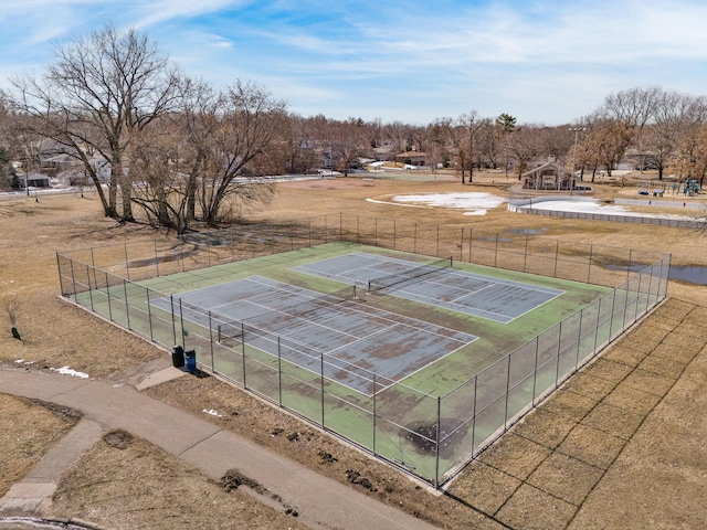 view of tennis court with fence