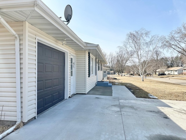 view of side of property with driveway