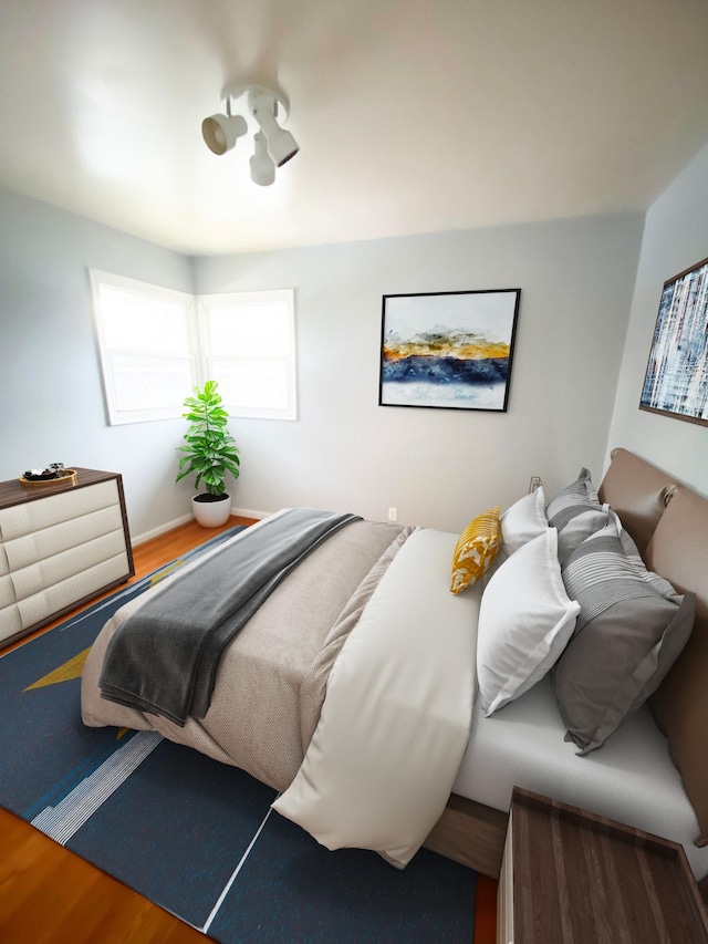 bedroom featuring wood finished floors