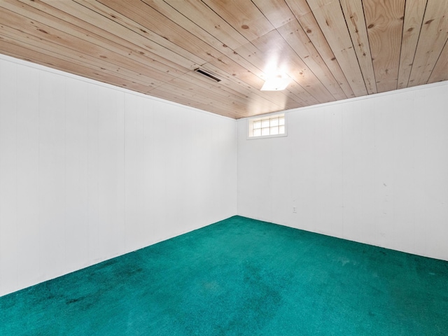 below grade area with carpet floors and wooden ceiling