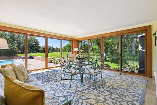 sunroom featuring visible vents