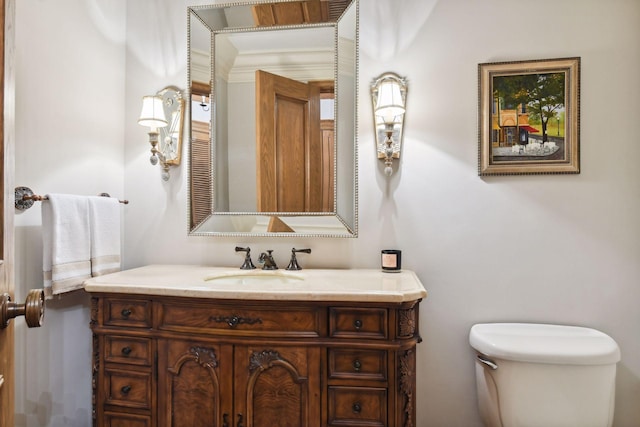 bathroom with toilet and vanity