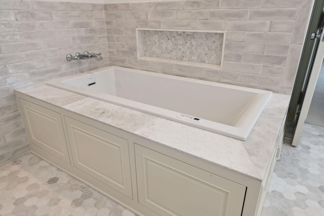 bathroom featuring a tub to relax in