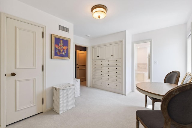 office featuring visible vents and light carpet