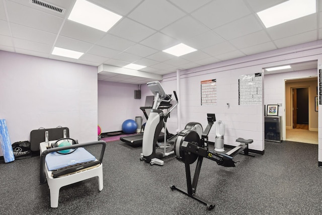 workout area featuring visible vents and a drop ceiling