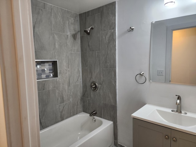 bathroom featuring vanity and washtub / shower combination