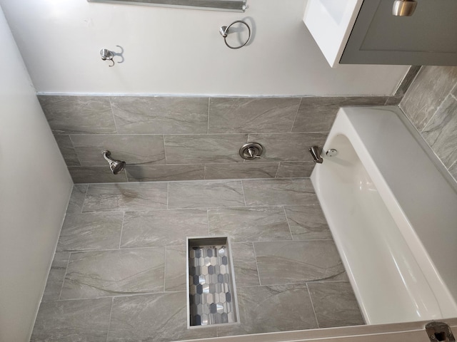 full bath with a bath and tiled shower