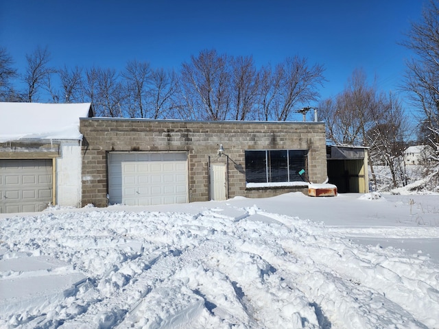 view of snow covered garage