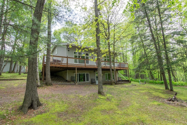 rear view of house featuring a deck