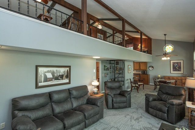 carpeted living area featuring a ceiling fan, high vaulted ceiling, and baseboards