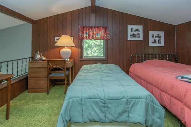 bedroom with vaulted ceiling with beams, carpet floors, and wood walls