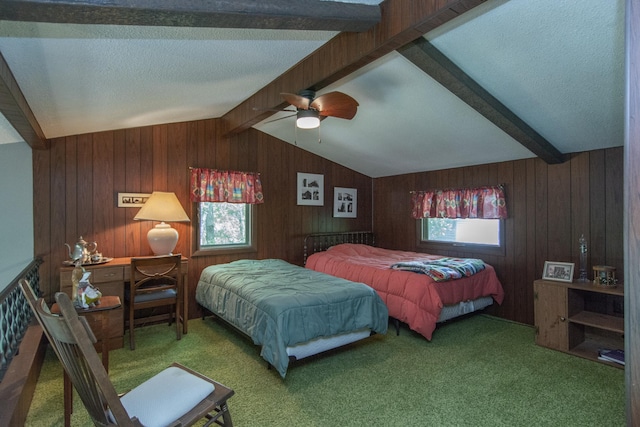 bedroom featuring lofted ceiling with beams, carpet, wooden walls, and ceiling fan