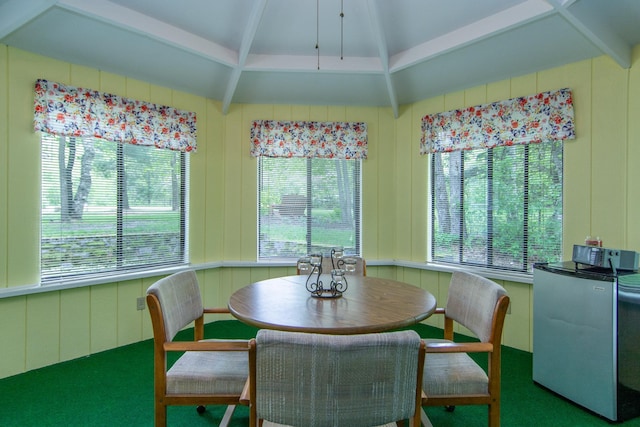 dining space featuring beam ceiling