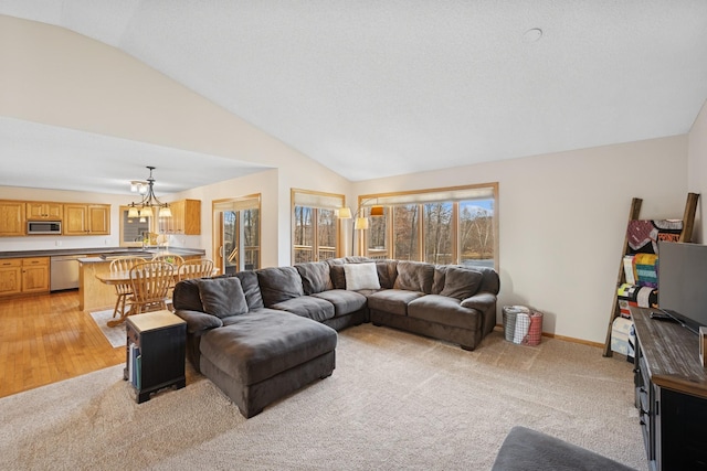 living area featuring lofted ceiling, light colored carpet, baseboards, and a chandelier