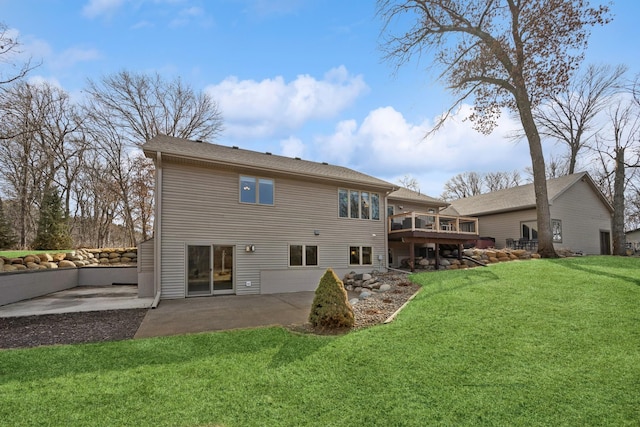 back of house with a deck, a yard, and a patio area