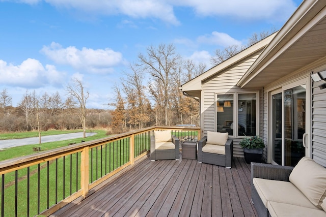 deck featuring a lawn and an outdoor hangout area