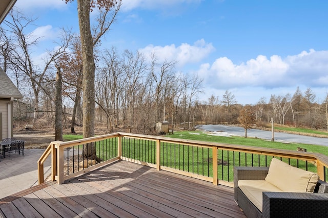 wooden deck featuring a yard