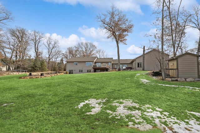 view of yard with an outbuilding and a deck