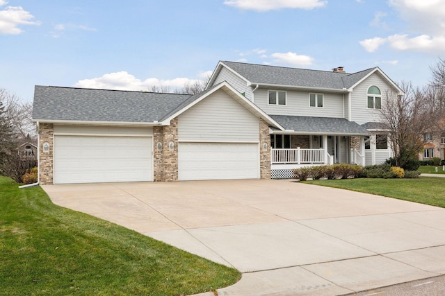 traditional-style home with brick siding, a porch, an attached garage, a front yard, and driveway